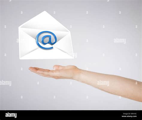 hand holding envelope with email sign Stock Photo - Alamy