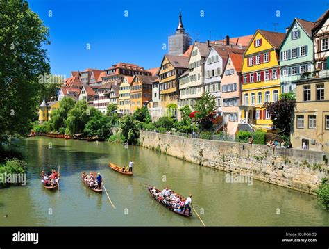 Punts on the Neckar River in Tuebingen, old houses of the river bank at ...