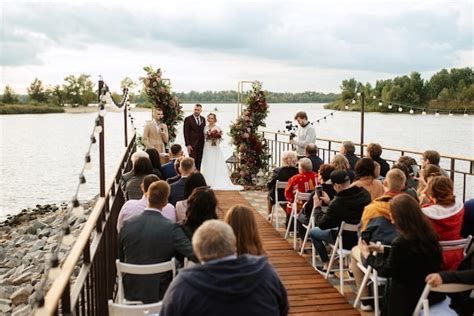 Premium Photo | Wedding ceremony of the newlyweds on the pier