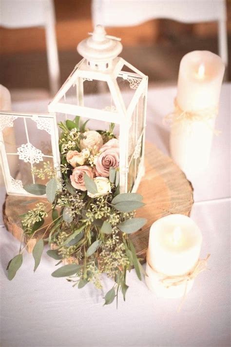 vintage white lantern wedding centerpiece with seeded eucalyptus | Lantern centerpiece wedding ...