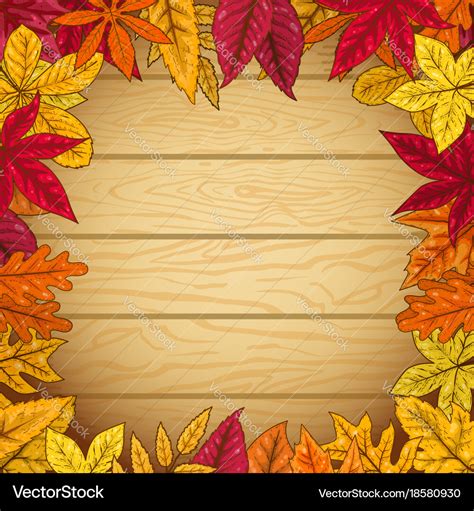 Border from autumn leaves on wooden background Vector Image