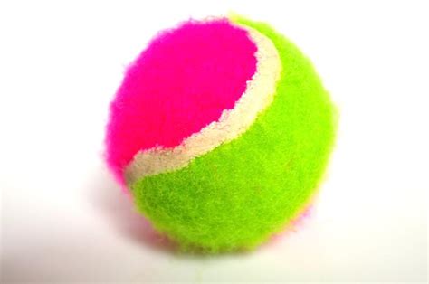 Tennis | Free Stock Photo | A pink and green tennis ball isolated on a ...