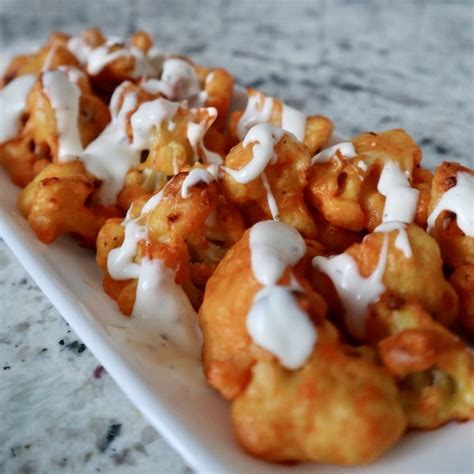 Baked Buffalo Cauliflower Bites - Honest & Well