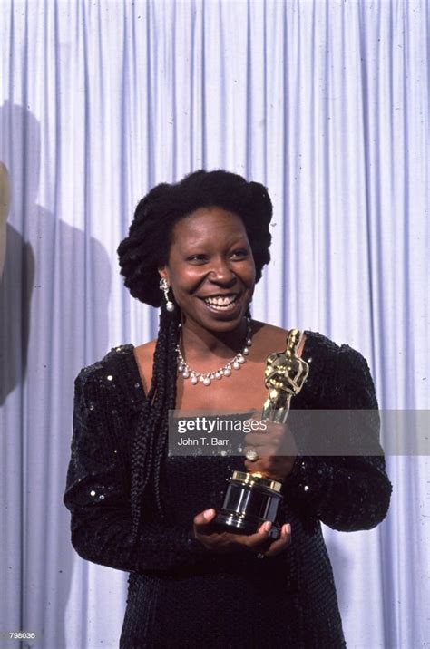 Whoopi Goldberg receives an Oscar at the 63Th Academy Awards on March ...