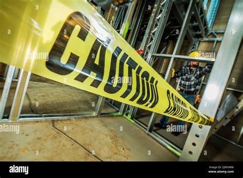 Construction Site Yellow Safety Caution Tapes. Industrial Theme Stock Photo - Alamy