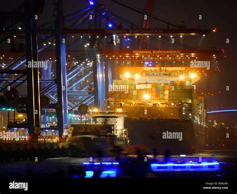 Container terminal by night Stock Photo - Alamy