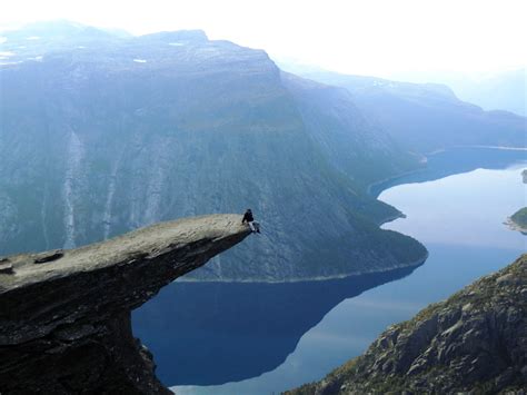 My friend on the edge of a cliff. Trolltunga, Norway [2048x1536] : r/AdrenalinePorn