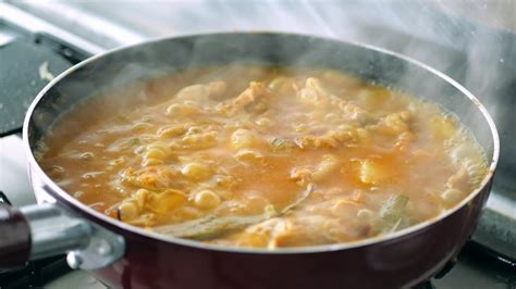 Simmering saucy food cooks in a stove top skillet 13826738 Stock Video ...