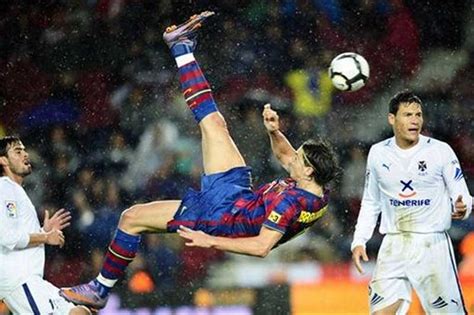 lionel messi photos were kicking a ball with the air spinning technique