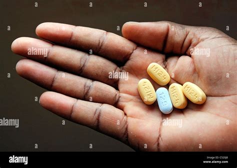 Hand with five tablets high-measured ARV Antiretoviral Medicine Stock Photo: 37538432 - Alamy