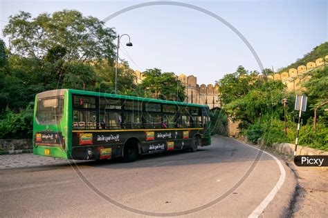 Image of A Jaipur city bus or low floor bus moving on amer road-TW697706-Picxy