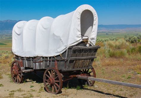 A Covered Wagon Along the Oregon Trail Stock Photo - Image of landscape ...