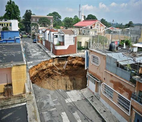 Crews probe Guatemala sinkhole as neighbours flee