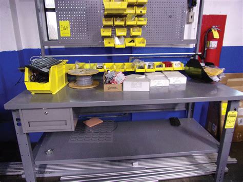 { Group of lots: 564, 565 } ULINE WORKBENCH WITH ASSORTED ELECTRICAL ITEMS