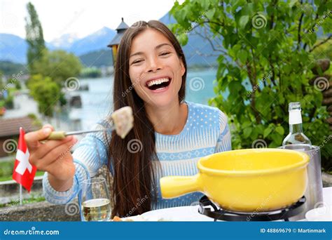 Swiss Cheese Fondue - Woman Eating Laughing Stock Photo - Image: 48869679