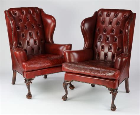 (2) Red leather wingback chairs w nailhead trim