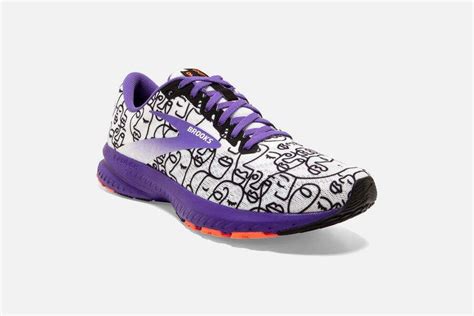 a pair of purple and white running shoes