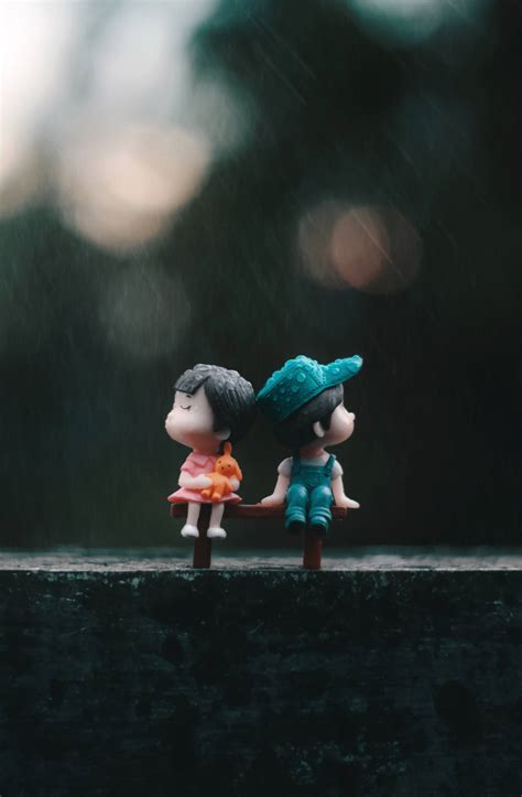 Download Cute Doll Couple In The Rain Wallpaper | Wallpapers.com