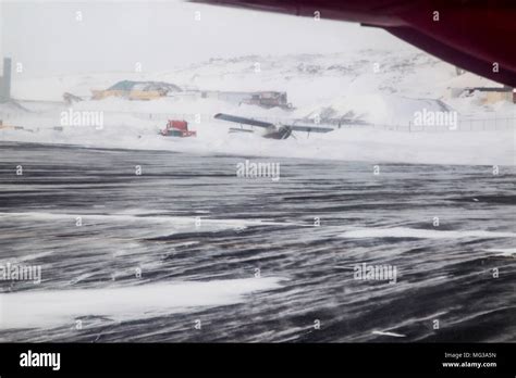 Aircraft on the ground in the snow of a blizzard at Iqaluit airport. Nunavut, Canada Stock Photo ...