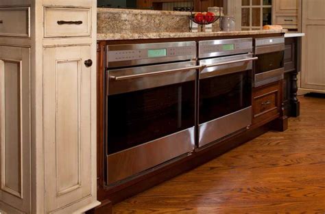 Sub Zero Refrigerator with Wood Panels - Giorgi Kitchens & Designs