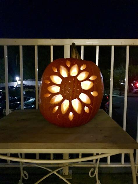 Sunflower Pumpkin Carving Design with LED light. Created this beautiful design with just the b ...