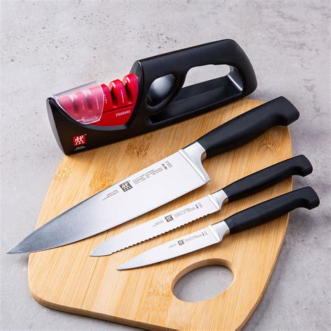 ZWILLING 4-Star Chef Knife Combo with Sharpener - Set of 4 | Kitchen Stuff Plus