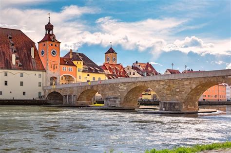 Premium Photo | Sunny stone bridge and regensburg bridge tower regensburg eastern bavaria germany