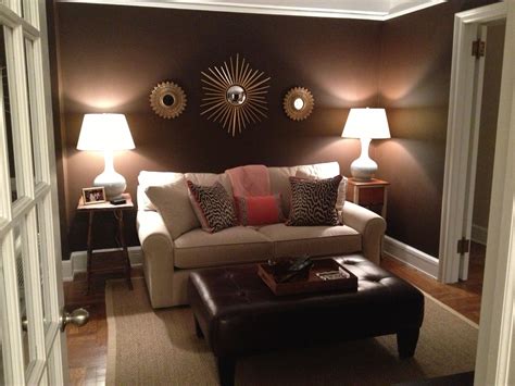 Den-Brown walls with accents of coral and blue create a sophisticated ...