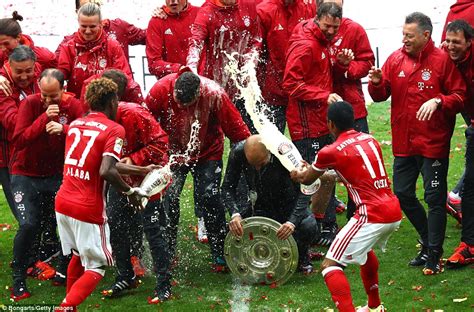 Bayern Munich players drench Pep Guardiola in beer after winning German ...