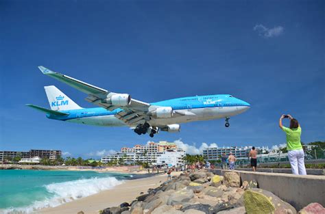 KLM Boeing 747 makes its final iconic landing over the beach on Sint Maarten - Lonely Planet