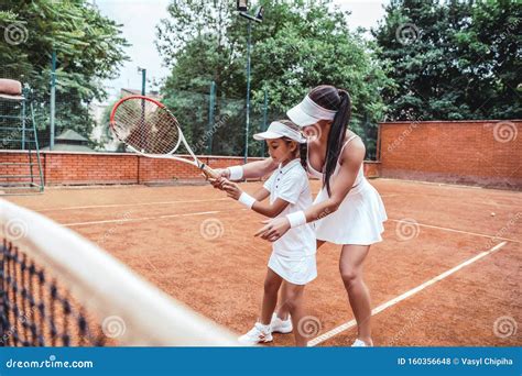 Tennis Coach Training for Young Kid Stock Photo - Image of daughter ...