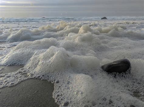 Sea foam Photograph by Laura H - Pixels