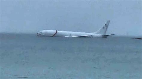 Navy Plane Overshoots Runway And Ends Up In Ocean, But All 9 Aboard Escape Unharmed | Weather ...