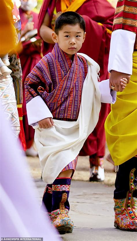 Crown Prince Jigme was pictured wearing the traditional gho, which is a ...