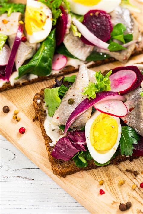 Beetroot and Pickled Marinated Herring Open Sandwich on Rye Bread Stock Photo - Image of omega ...