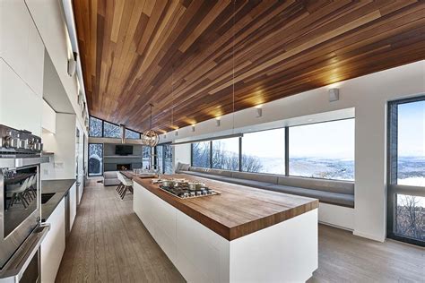 Modern ski chalet nestled in snowy slopes of the Laurentian Mountains | Ski chalet, Chalet ...