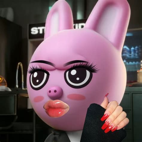 a close up of a person wearing a pink bunny mask and holding a finger in front of her face