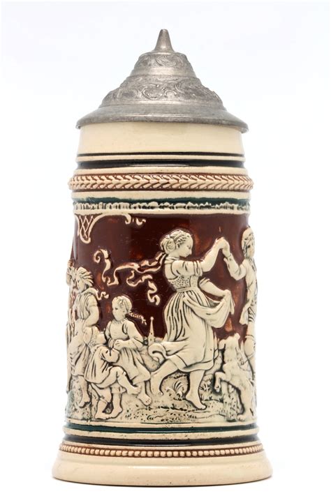 File:Faience beer stein with ball scene on brown background 03.jpg - Wikimedia Commons