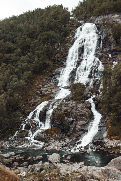 Premium Photo | A beautiful large waterfall in norway falls from a high ...