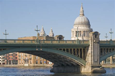 Southwark Bridge, London, with the dome of St Paul's Cathedral behind ...