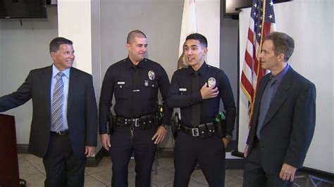 LAPD officers honor fathers by wearing their badges - ABC News