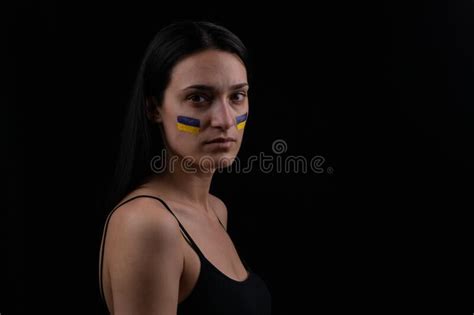Portrait of Serious Ukrainian Woman with Blue and Yellow Ukrainian Flag on Her Cheek.the Symbol ...