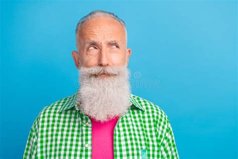 Portrait of Minded Aged Man Look Interested Empty Space Hesitate Isolated on Blue Color ...