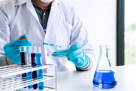 Biochemistry Laboratory Research, Chemist is Analyzing Sample in Stock Photo - Image of ...