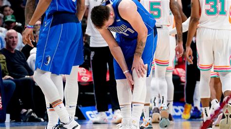 Luka Doncic injury puts playoff status in doubt as Mavericks top Spurs ...