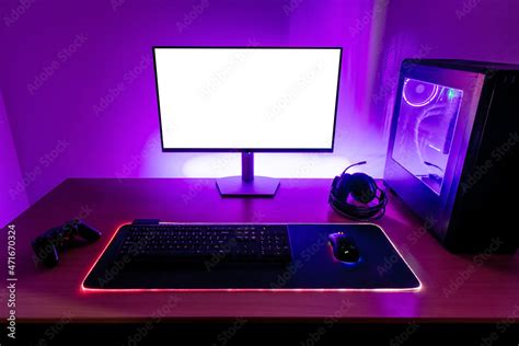 Foto de Desk with gaming setup. Display with isolated screen for mockup ...