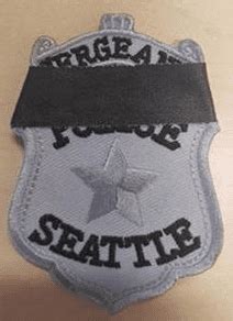 Seattle police ordered to keep badge numbers visible when wearing ...