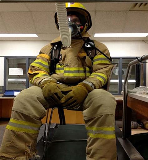 1 A firefighter in turnout gear over his station uniform. | Download ...