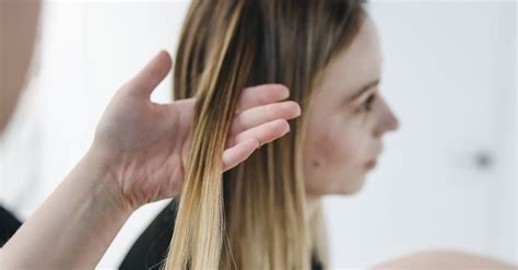 Photo of Person Ironing a Woman's Hair · Free Stock Photo