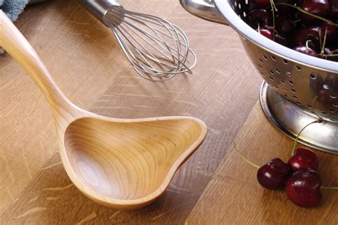 Handcrafted wooden serving spoon ladle with pour spout